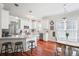 Inviting kitchen featuring white cabinets, granite countertops, stainless steel appliances, and an adjacent dining area at 225 Silverwood Ln, Summerville, SC 29485