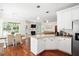 Bright living spaces offering a view of the kitchen, dining table, fireplace, and comfortable sectional sofa at 225 Silverwood Ln, Summerville, SC 29485