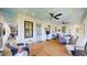 Expansive back porch perfect for outdoor gatherings and relaxation with lovely views and cozy seating arrangements at 2312 Rushland Landing Rd, Johns Island, SC 29455