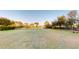 Large, fenced backyard with a view of the lake and mature trees at 2312 Rushland Landing Rd, Johns Island, SC 29455