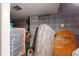 An unfinished basement space with concrete block walls and floor, with stored household items, and a utility access point at 2312 Rushland Landing Rd, Johns Island, SC 29455