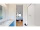 Bathroom showcasing blue cabinets with a bedroom view through a doorway and a walk-in shower at 2312 Rushland Landing Rd, Johns Island, SC 29455