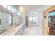 Spacious bathroom with double vanity, sauna, marble floors, and a luxurious bathtub at 2312 Rushland Landing Rd, Johns Island, SC 29455