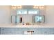 Bathroom with double sink vanity, marble countertop, and built-in storage at 2312 Rushland Landing Rd, Johns Island, SC 29455