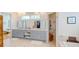 Bathroom featuring double vanity, marble floors, and a glimpse of a walk-in closet at 2312 Rushland Landing Rd, Johns Island, SC 29455
