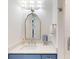 Elegant bathroom with a blue vanity, white countertop, and modern fixtures next to a glass door shower at 2312 Rushland Landing Rd, Johns Island, SC 29455