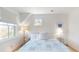 Bedroom featuring a bed with a patterned quilt, wood floors, and natural light at 2312 Rushland Landing Rd, Johns Island, SC 29455