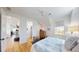 Bright bedroom features a bed, wood floors, and two doorways to adjacent rooms at 2312 Rushland Landing Rd, Johns Island, SC 29455