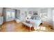 Bright bedroom with light wood floors, seating area, and multiple windows for natural light at 2312 Rushland Landing Rd, Johns Island, SC 29455