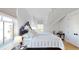 Bright bedroom featuring a bed with a patterned quilt, white walls, and large windows at 2312 Rushland Landing Rd, Johns Island, SC 29455