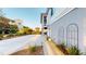 A long driveway leads up to the home with decorative planters and foliage at 2312 Rushland Landing Rd, Johns Island, SC 29455