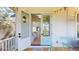 Beautiful entryway with French doors, wood flooring, and a view into the house and outside from the front porch at 2312 Rushland Landing Rd, Johns Island, SC 29455