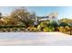 Large modern home exterior surrounded by lush landscaping and spacious driveway at 2312 Rushland Landing Rd, Johns Island, SC 29455