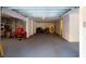 A spacious garage with gray epoxy floors, white walls, and a large storage area for household items and tools at 2312 Rushland Landing Rd, Johns Island, SC 29455