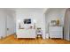 Hallway featuring a large dresser, TV, lamps, and light wood flooring at 2312 Rushland Landing Rd, Johns Island, SC 29455