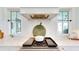 A modern kitchen featuring a range with custom vent hood, white subway tile backsplash, and marble countertops at 2312 Rushland Landing Rd, Johns Island, SC 29455