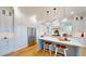 Kitchen showcasing white cabinets, stainless steel appliances, a center island with seating, and a range with vent hood at 2312 Rushland Landing Rd, Johns Island, SC 29455