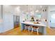 Spacious kitchen featuring a large island with seating, white cabinets, and stainless steel appliances at 2312 Rushland Landing Rd, Johns Island, SC 29455