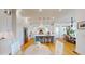 Open-concept kitchen and dining area featuring white cabinets, a center island with seating, and stainless steel appliances at 2312 Rushland Landing Rd, Johns Island, SC 29455