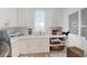 White laundry room features a sink, washer and dryer, white cabinets and storage space at 2312 Rushland Landing Rd, Johns Island, SC 29455