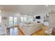 Spacious living room featuring large windows, French doors, and comfortable seating, great for relaxation at 2312 Rushland Landing Rd, Johns Island, SC 29455