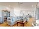 Open-concept living room with hardwood floors, a neutral palette, and a seamless flow into the kitchen at 2312 Rushland Landing Rd, Johns Island, SC 29455