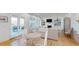 Bright living room featuring a fireplace, built-in shelving, hardwood floors and access to an outdoor patio at 2312 Rushland Landing Rd, Johns Island, SC 29455