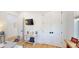 Office area featuring hardwood floors, white trim, and a mounted TV, perfect for a modern workspace at 2312 Rushland Landing Rd, Johns Island, SC 29455