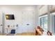 Bright office space features hardwood floors, white trim, a mounted TV, and ample natural light at 2312 Rushland Landing Rd, Johns Island, SC 29455