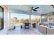 Covered porch featuring outdoor seating, grill, and a view of the nearby lake at 2312 Rushland Landing Rd, Johns Island, SC 29455