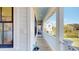 Comfortable side porch with a view of the home, the yard, and the neighborhood at 2312 Rushland Landing Rd, Johns Island, SC 29455