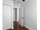 Bedroom has closet, a window, wood flooring, and neutral paint at 2313 Kent Ave, North Charleston, SC 29405