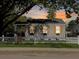Charming home with a white picket fence, shutters, flower boxes, and sunset sky at 2313 Kent Ave, North Charleston, SC 29405