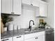 Modern kitchen features white cabinets, granite countertops, and stainless appliances at 2313 Kent Ave, North Charleston, SC 29405