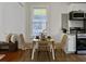Charming kitchen and dining area with stainless appliances, bright window, and comfortable seating for four at 2313 Kent Ave, North Charleston, SC 29405