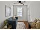 Comfortable living area with a blue sofa, stylish decor, and an open flow into the dining space, filled with natural light at 2313 Kent Ave, North Charleston, SC 29405