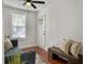 Inviting living space with a comfortable blue sofa, light-filled window, and wood floors for a warm, welcoming feel at 2313 Kent Ave, North Charleston, SC 29405
