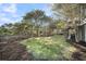 Spacious backyard features lush lawn, mature trees and mulch bed for easy landscaping at 2340 Salt Wind Way, Mount Pleasant, SC 29466