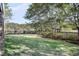 Beautiful backyard featuring a well-maintained lawn, a wooden fence and mature trees that provide privacy at 2340 Salt Wind Way, Mount Pleasant, SC 29466