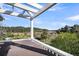 Scenic balcony featuring a brown hot tub, lush greenery, and a clear sky backdrop, perfect for relaxation at 2340 Salt Wind Way, Mount Pleasant, SC 29466