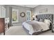 Bedroom featuring cozy décor, large windows, and a gray upholstered headboard at 2340 Salt Wind Way, Mount Pleasant, SC 29466