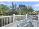 Deck features a scenic view with blue Adirondack chairs, ideal for relaxing outdoors at 2340 Salt Wind Way, Mount Pleasant, SC 29466