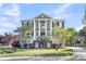 Elegant two-story home featuring stately columns, dual staircases and beautiful landscaping at 2340 Salt Wind Way, Mount Pleasant, SC 29466