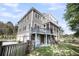 This home boasts a screened in porch, balcony with pergola, and a multi-car garage at 2340 Salt Wind Way, Mount Pleasant, SC 29466