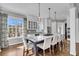Bright kitchen features a large island, pendant lighting, white cabinets and stainless appliances at 2340 Salt Wind Way, Mount Pleasant, SC 29466