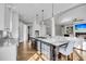 Open concept kitchen featuring a large central island that flows into the living area at 2340 Salt Wind Way, Mount Pleasant, SC 29466