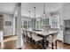 Spacious kitchen featuring a large island with seating, and hardwood flooring at 2340 Salt Wind Way, Mount Pleasant, SC 29466