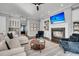 Inviting living room with a fireplace, built-in shelves, and comfortable seating at 2340 Salt Wind Way, Mount Pleasant, SC 29466