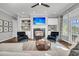 Inviting living room featuring a fireplace with built-in shelves, comfortable seating, and a bright, airy atmosphere at 2340 Salt Wind Way, Mount Pleasant, SC 29466