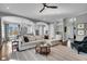 Spacious living room with an open floor plan, flowing into the kitchen, and elegant furnishings at 2340 Salt Wind Way, Mount Pleasant, SC 29466